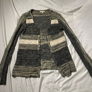 A knitted cardigan with lace detail